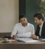 Finance professionals reviewing UAE Corporate Tax relief documentation
